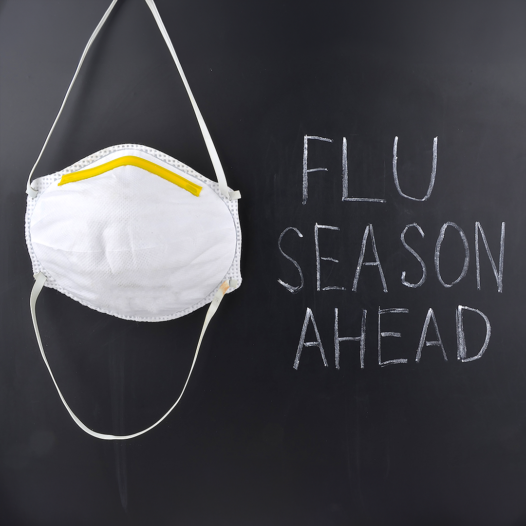 mask on chalk board - flu season ahead